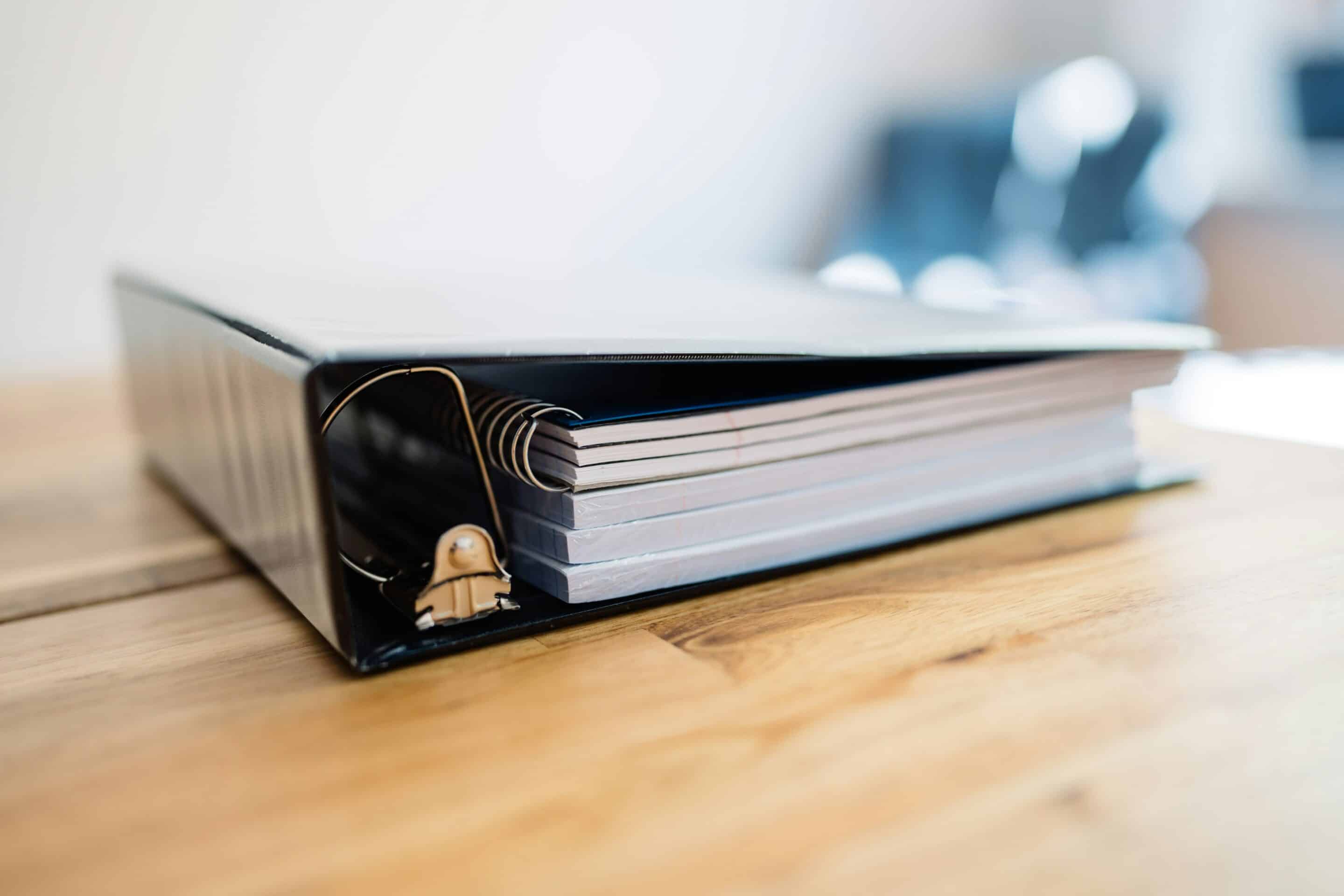 Photo of a binder filled with board governance documents