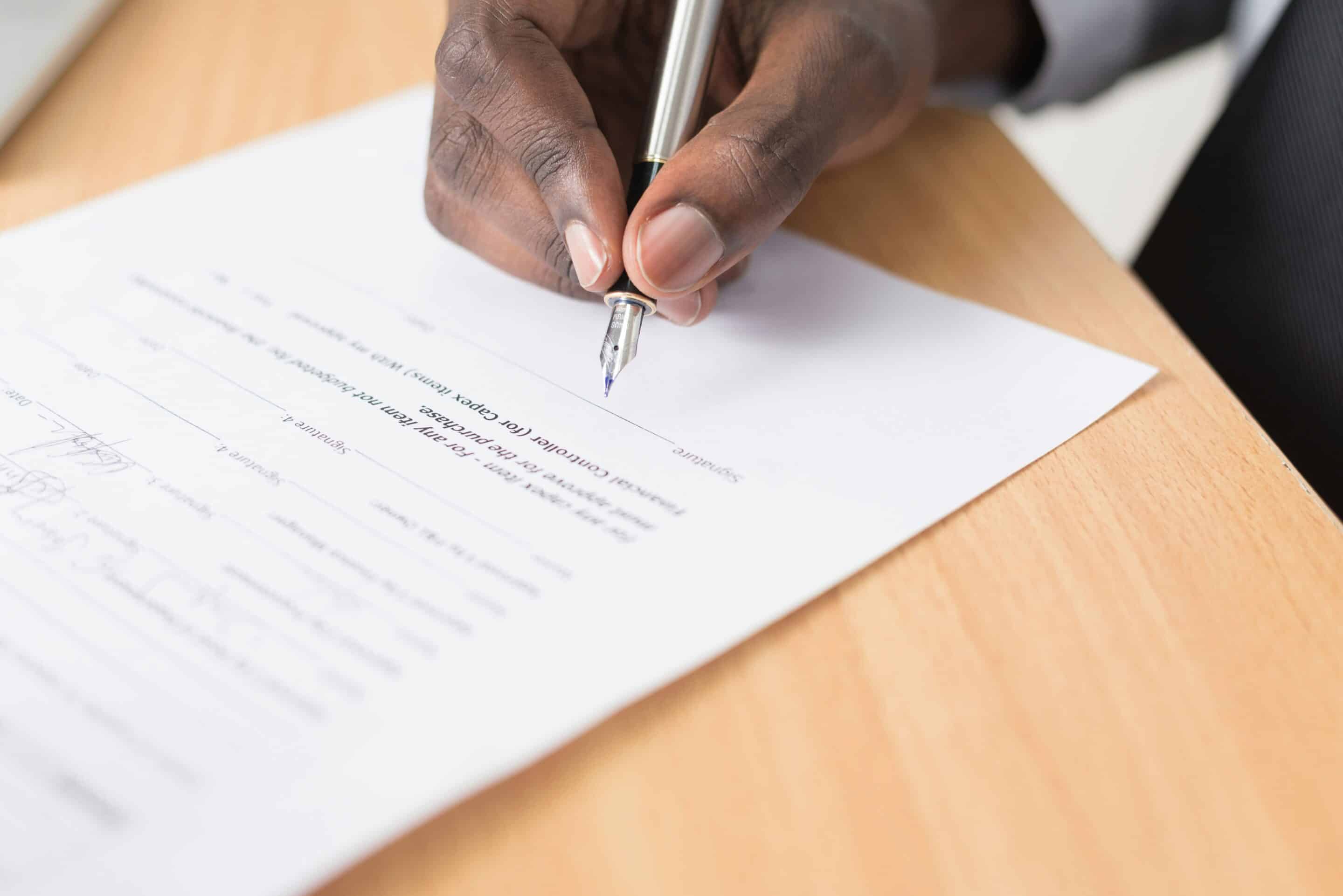 New board member signing a list of expectations