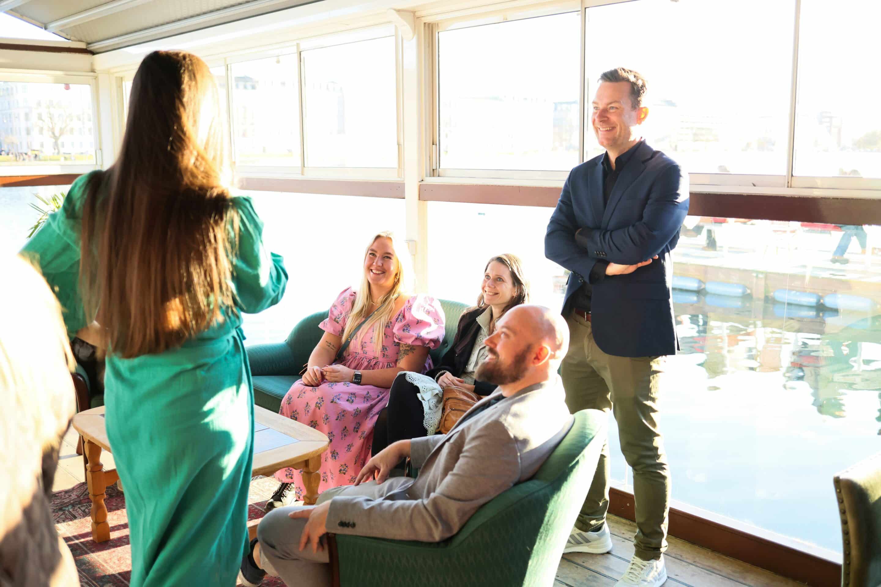Photo of nonprofit staff meeting informally with the new interim executive director